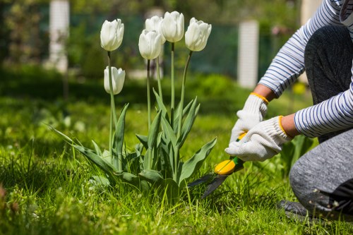 Gardener preparing tools at a Chessington front garden